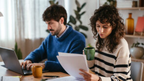 A couple reviewing documents in preparation for filing their taxes