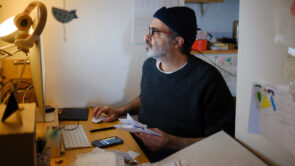 A small business owner working on their taxes from their home office