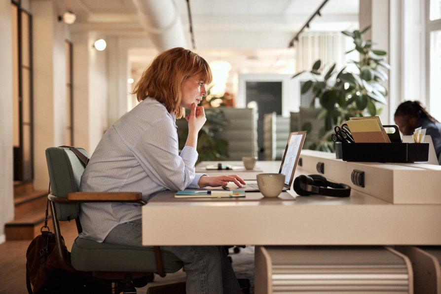 A woman working at her computer