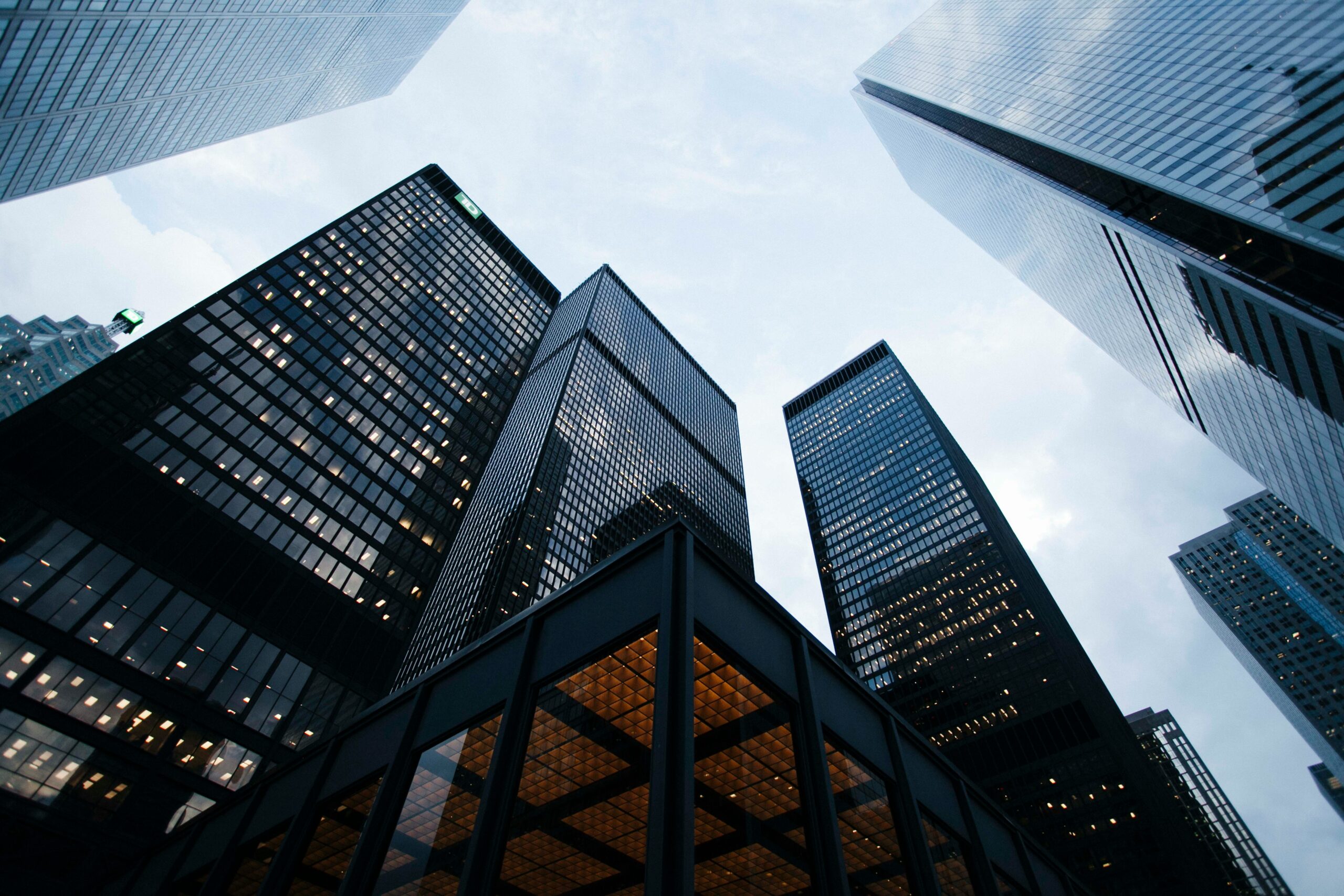 Tall skyscrapers towering against the sky, representing corporate offices and business hubs.