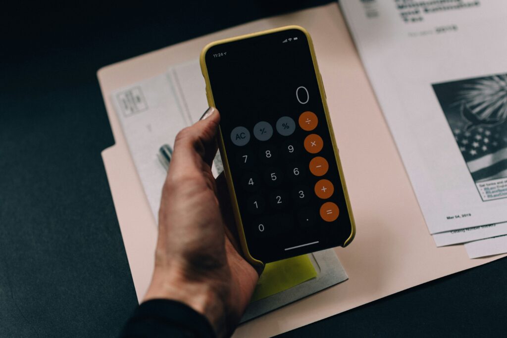 A smartphone displaying a financial dashboard, symbolizing the use of modern tools to manage installment sales. This approach allows business owners to spread out tax liability over time, easing the burden from a large one-time gain.