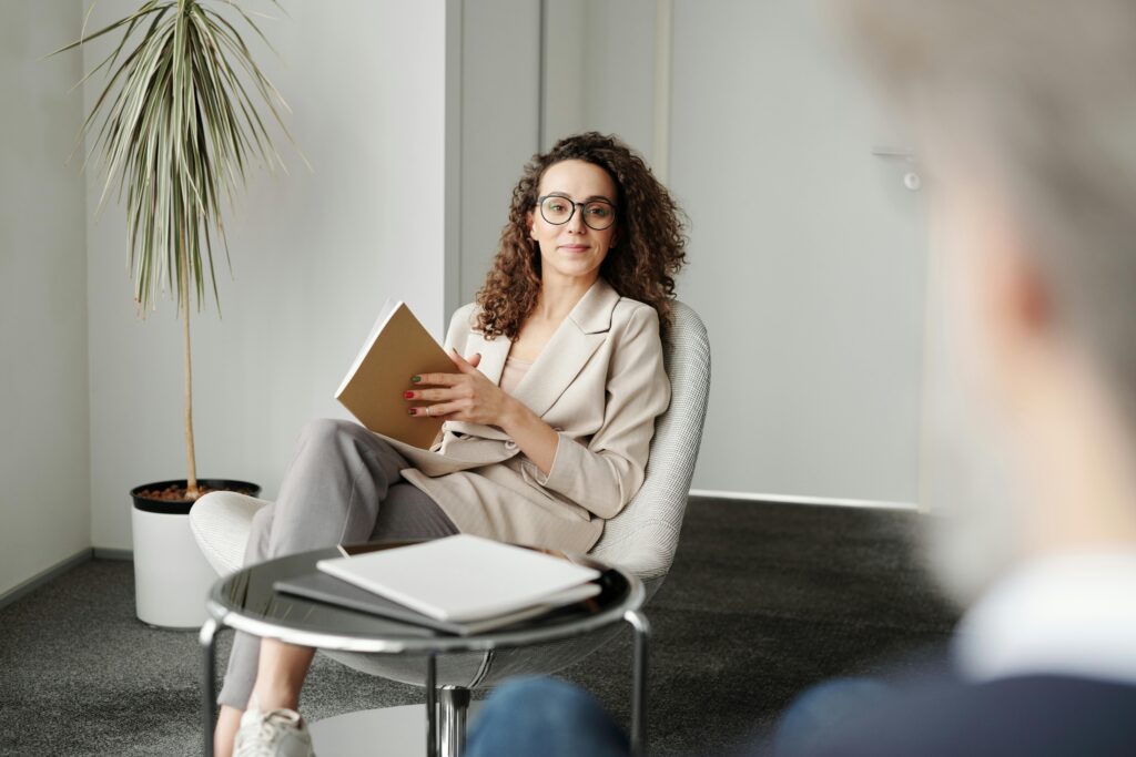 A professional holding a notebook in a modern workspace—symbolizing the in-depth analysis tax advisors must perform to apply new OBBB provisions like Trump Accounts and expanded SALT caps.