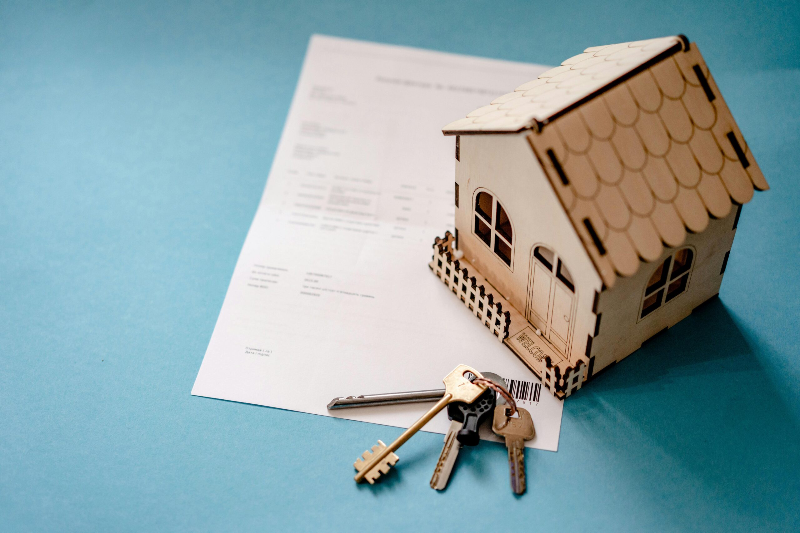 Image of a little wooden house on a table.