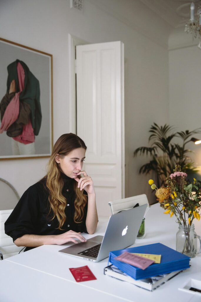 A woman studying data on a computer