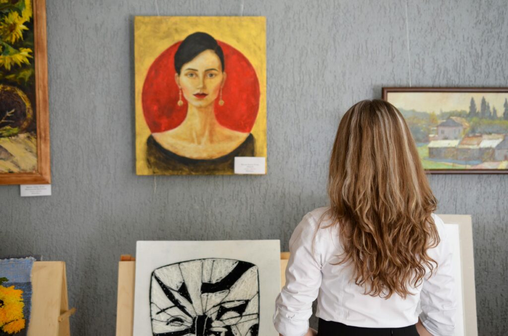 A woman browsing fine art