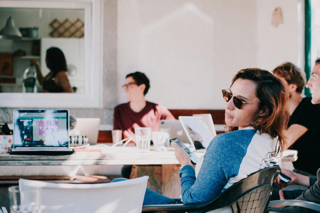 A confident startup founder smiles in the sun—symbolizing the increased exit flexibility and expanded tax savings offered by OBBB’s new QSBS tiers for early investors and founders.
