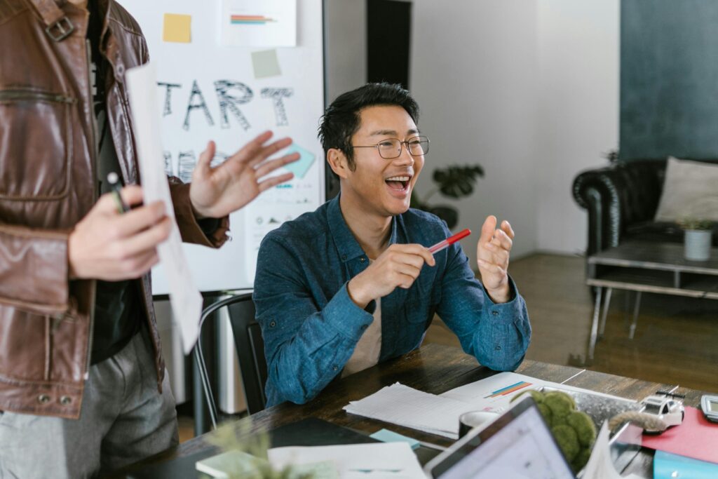 Two startup founders collaborate on a go-to-market strategy—capturing the high-stakes planning tech entrepreneurs must undertake in response to the OBBB’s new tax and regulatory landscape.