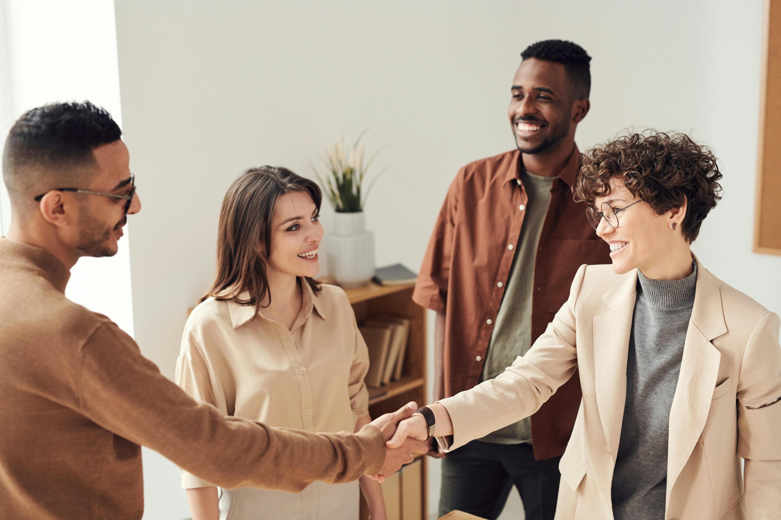 Photo of people shaking hands.
