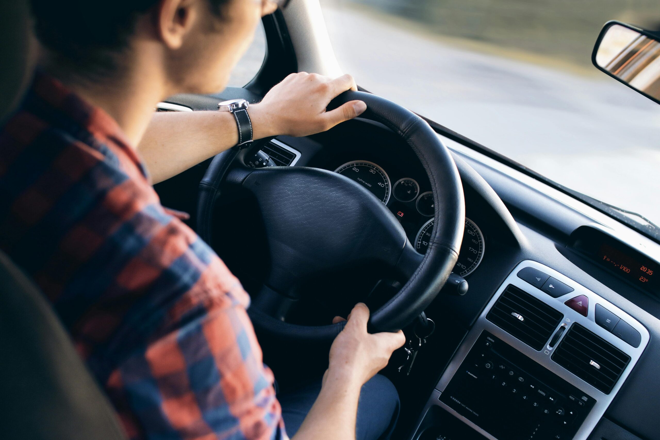Image of a man driving a vehicle.