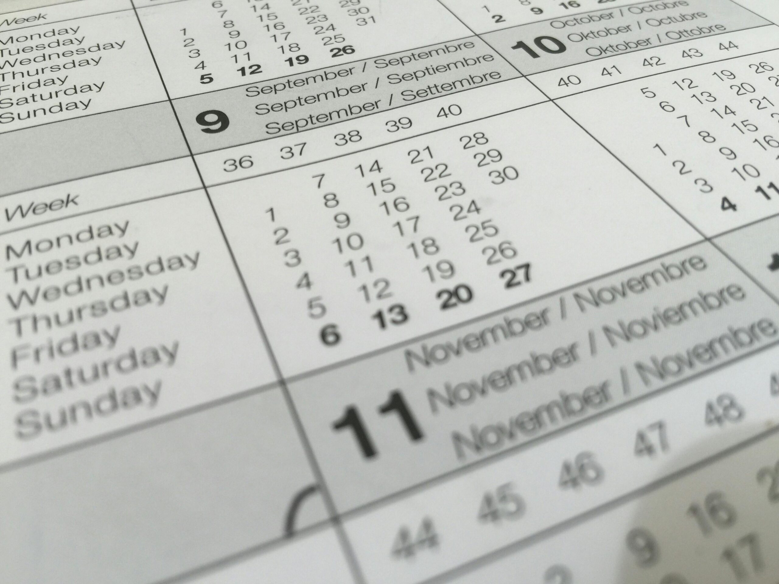 A close-up of a white calendar page, symbolizing key deadlines and timing considerations related to SECURE Act 2.0 provisions, such as required minimum distributions and the 10-year rule for inherited IRAs.