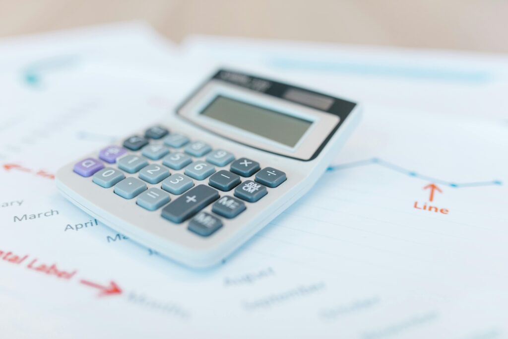 Image of a calculator on tax paperwork.